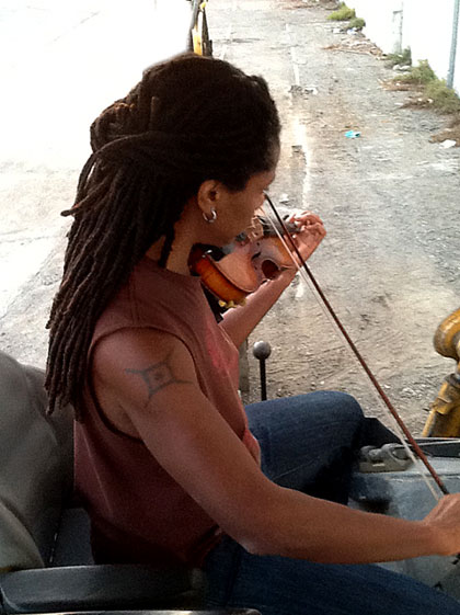 photo of Marilyn McNeal on a tractor in West Oakland
